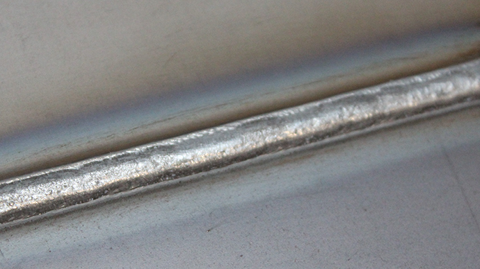 Pulse welding using low slug wire and Acom HT